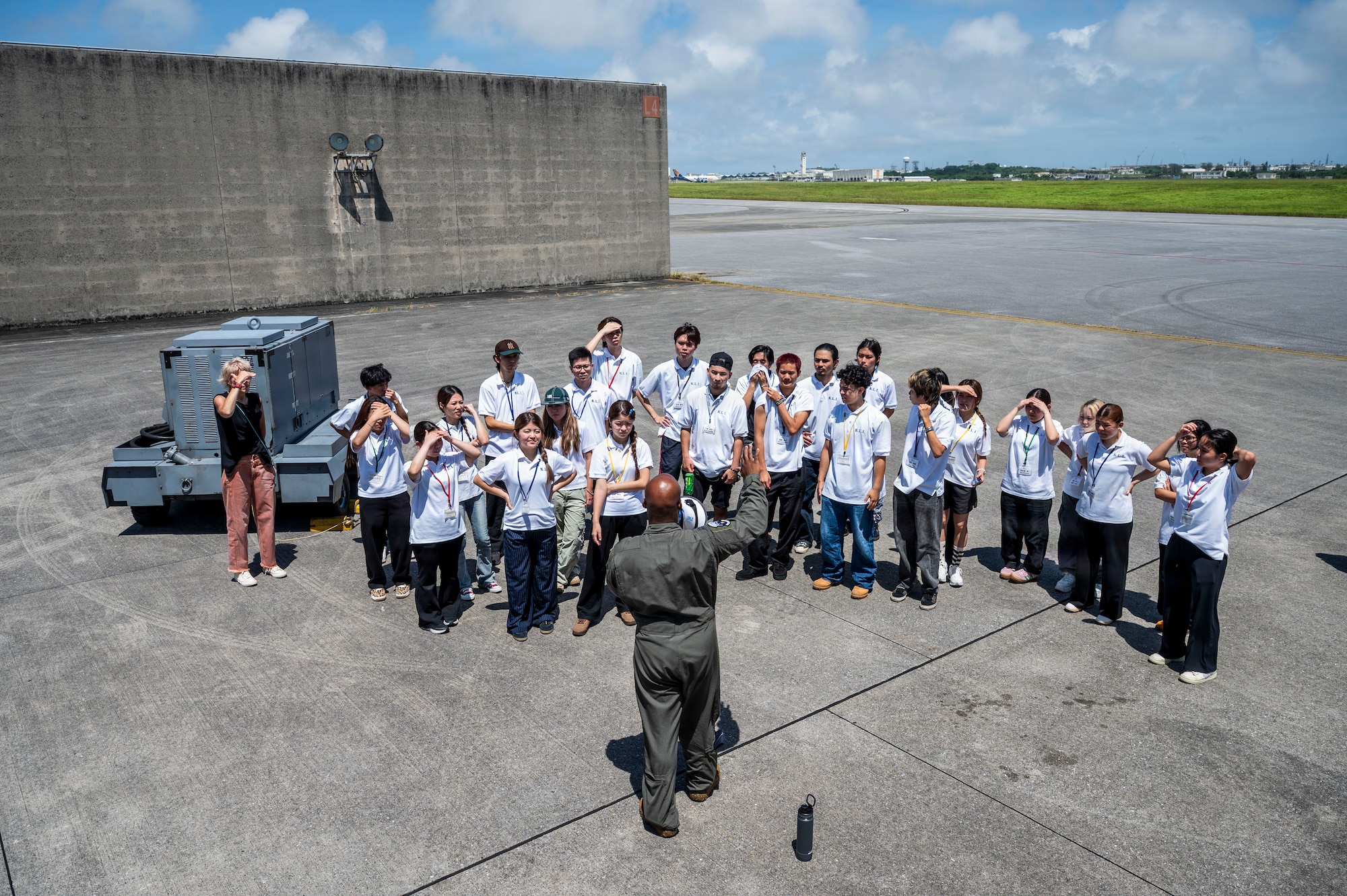 U.S. Air Force Capt. William Thornton, 909th Air Refueling Squadron assistant execution flight commander, briefs Kadena Language Institute students and teachers on the functions of a KC-135 Stratotanker as part of a tour at Kadena Air Base, Japan, July 17, 2026.