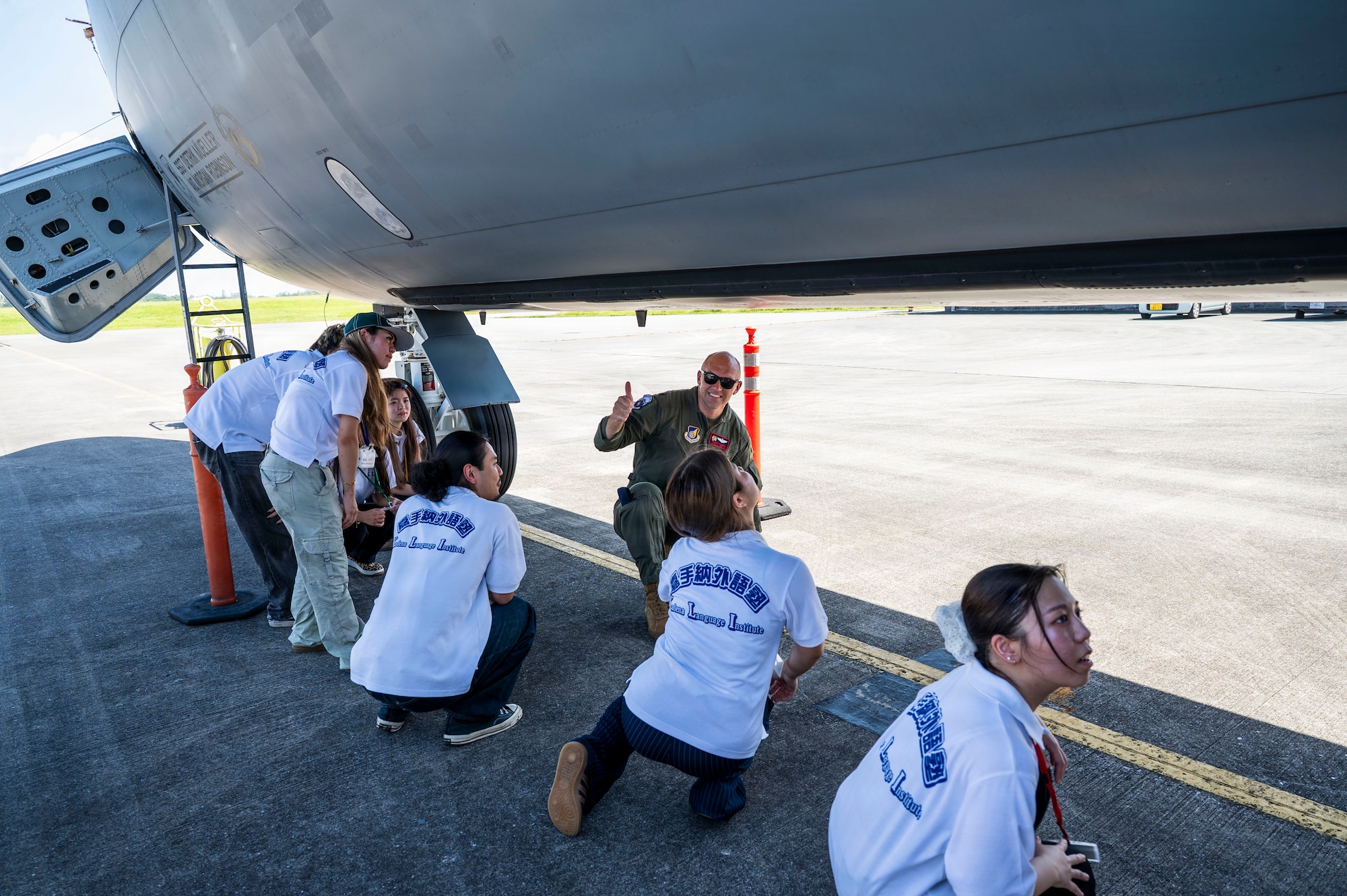 U.S. Air Force Lt. Col. Brandon Krupa, 909th Air Refueling Squadron director of operations, explains functions of a KC-135 Stratotanker to Kadena Language Institute students during a tour at Kadena Air Base, Japan, July 17, 2026.