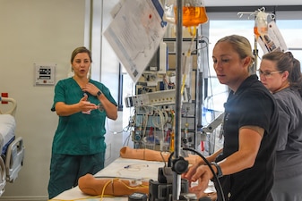 A team of medical personnel at Naval Medical Center Camp Lejeune on August 27, 2025,  gather data for an evidence-based practice project led by Navy Cmdr. Emily Latimer, emergency clinical nurse specialist with Navy Medicine Readiness and Training Command Camp Lejeune. Latimer’s project was awarded by the Defense Health Agency Nursing Award for Evidence-Based Practice for her leadership on examining methods for administering blood specifically to pediatric trauma patients.