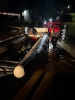 Members of the West Virginia National Guard Swift Water Rescue Team load their boat into floodwaters in north central West Virginia, the night of July 21, 2026.