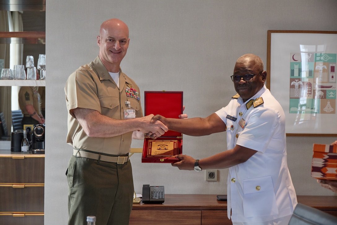 U.S. Marine Corps Maj. Gen. Daniel Shipley, commander of U.S. Marine Corps Forces, Europe and Africa, left, receives a gift from Ghana Navy Commodore Samuel Ayelazono, right, in Rabat, Morocco, July 19, 2026. Shipley and Ayelazono met during African Maritime Forces Summit 2026 to build their relationship and discuss the complexities of maritime security. Co-hosted by the Royal Moroccan Armed Forces, U.S. Naval Forces Africa, and U.S. Marine Corps Forces, Europe and Africa, AMFS 2026 brings together international partners to address shared security challenges under the theme "Innovation and Partnership to Strengthen Maritime Security." (U.S. Marine Corps photo by Cpl. Garrett Gillespie)