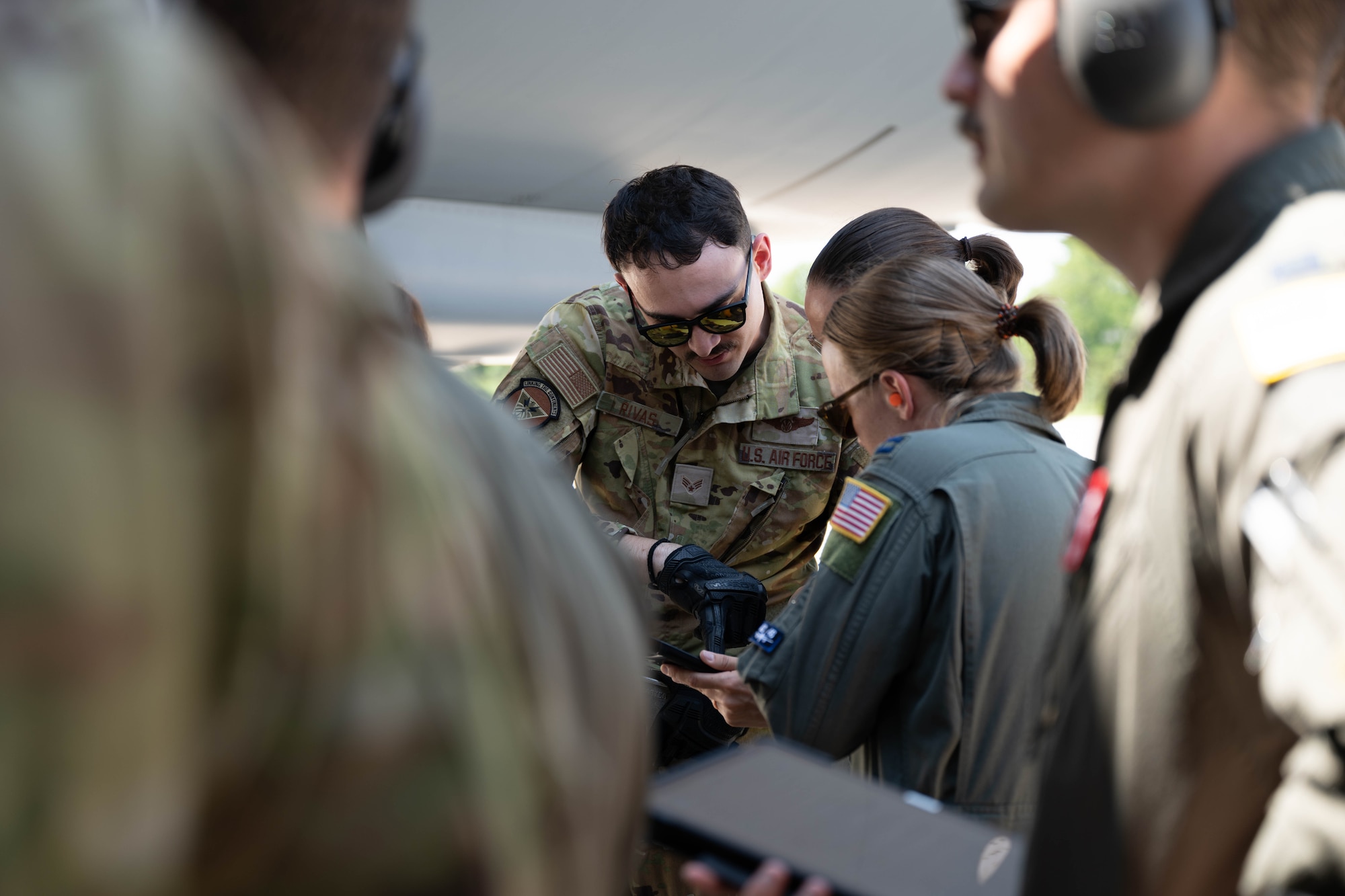 U.S. Air Force Senior Airman Brandon Rivas, 32nd Air Refueling Squadron instructor boom operator, goes over standard operating procedures during specialized fueling operations with Capt. Anna Tuma, 32nd Air Refueling Squadron pilot, at Joint Base McGuire-Dix-Lakehurst, N.J., June 29, 2026.
