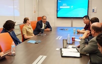 SAN ANTONIO (July 21, 2026) Chief Science Director Darrin Frye of Naval Medical Research Unit (NAMRU) San Antonio, joined by Cmdr. Rachel Condon, interim director, Craniofacial Health and Restorative Medicine, speaks with the delegation from the Houston-based TradeIL South-Midwest USA of Israel’s Foreign Trade Administration at VelocityTX Innovation Center. Israel’s Foreign Trade Administration actively manages programs and events across different regions. Their North American and European divisions host targeted symposiums and exhibitions to promote Israel's top export categories, which are heavily focused on capital goods, integrated circuits, medical instruments, and advanced cybersecurity software. NAMRU San Antonio, part of Navy Medicine Research & Development, conducts gap-driven combat casualty care, craniofacial, and directed energy research in support of Navy, Marine Corps and joint U.S. warfighter health readiness and lethality while engaged in routine and expeditionary operations. Navy Medicine’s 44,000+ talented and ready forces optimize health readiness, deliver quality healthcare, and provide global expeditionary medical support to warfighters. (U.S. Navy Photo by Burrell Parmer/Released)