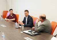 SAN ANTONIO (July 21, 2026) Yair Albin (center), economic consul for the Houston-based TradeIL South-Midwest USA of Israel’s Foreign Trade Administration, speaks with research directors from Naval Medical Research Unit (NAMRU) San Antonio, U.S. Army Institute of Surgical Research, and U.S. Air Force 59th Medical Wing at VelocityTX Innovation Center. Israel’s Foreign Trade Administration actively manages programs and events across different regions. Their North American and European divisions host targeted symposiums and exhibitions to promote Israel's top export categories, which are heavily focused on capital goods, integrated circuits, medical instruments, and advanced cybersecurity software. NAMRU San Antonio, part of Navy Medicine Research & Development, conducts gap-driven combat casualty care, craniofacial, and directed energy research in support of Navy, Marine Corps and joint U.S. warfighter health readiness and lethality while engaged in routine and expeditionary operations. Navy Medicine’s 44,000+ talented and ready forces optimize health readiness, deliver quality healthcare, and provide global expeditionary medical support to warfighters. (U.S. Navy Photo by Burrell Parmer/Released)