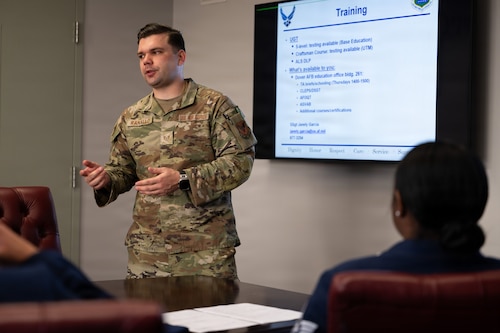 U.S. Air Force Staff Sgt. Cody Ranallo, Air Force Mortuary Affairs Operations noncommissioned officer in charge of readiness and plans, reviews training items with a new group of deployers during in-processing, Dover Air Force Base, Delaware, April 1, 2026. (U.S. Air Force photo by Jason Minto)