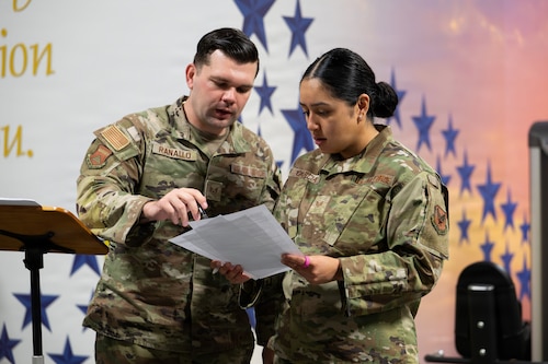 U.S. Air Force Staff Sgt. Cody Ranallo, Air Force Mortuary Affairs Operations noncommissioned officer in charge of readiness and plans, and U.S. Air Force Staff Sgt. Janely Mireya Garcia, AFMAO unit training manager, review checklist items during the in-processing of new deployers, Dover Air Force Base, Delaware, April 1, 2026. (U.S. Air Force photo by Jason Minto)