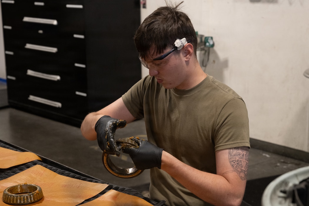 Airman greases bearings for a tire assembly