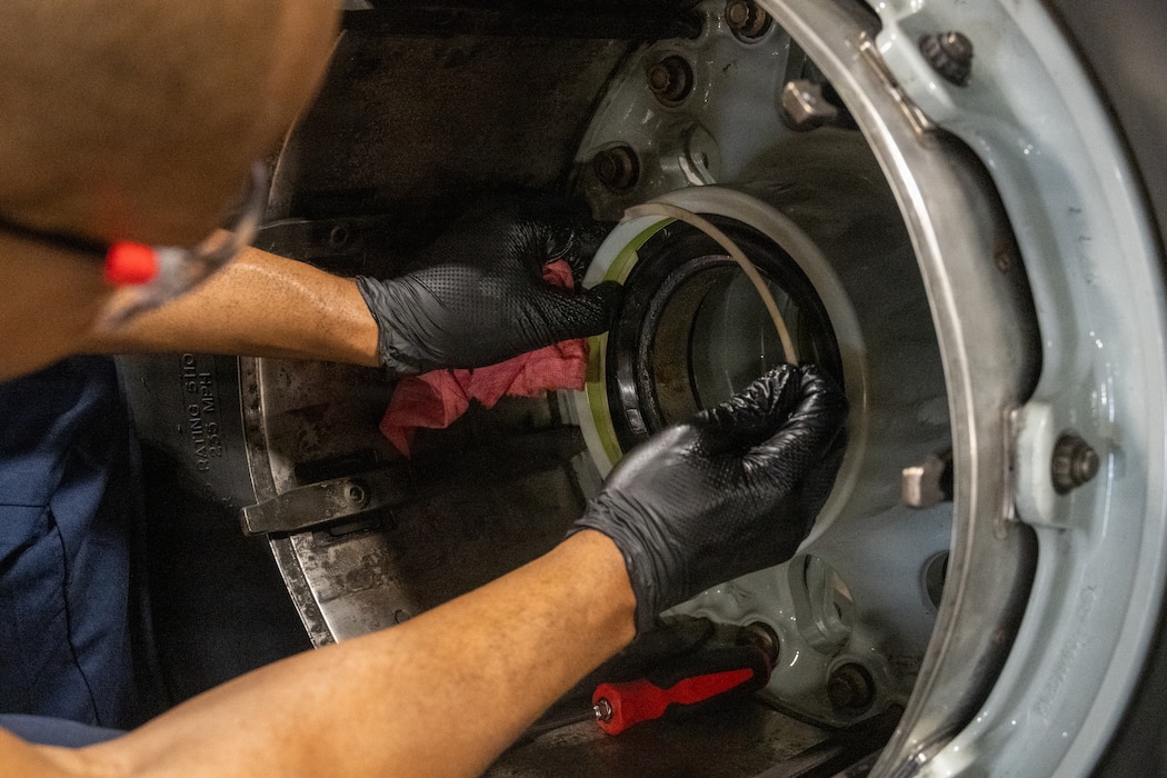Airman assembling wheel halves