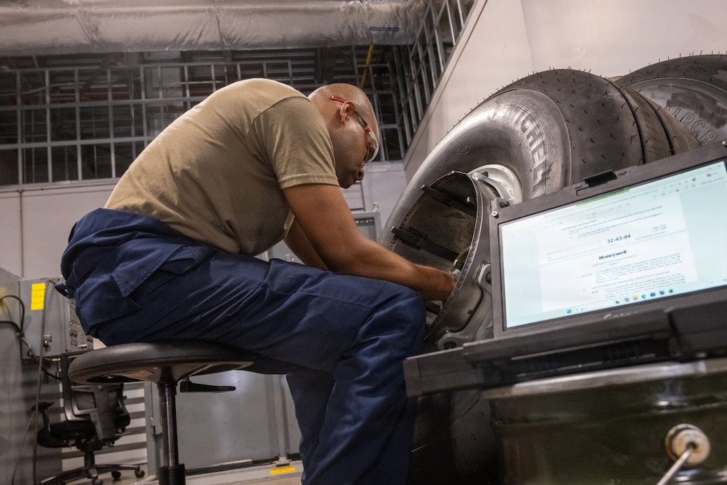 Airman assembling wheel halves