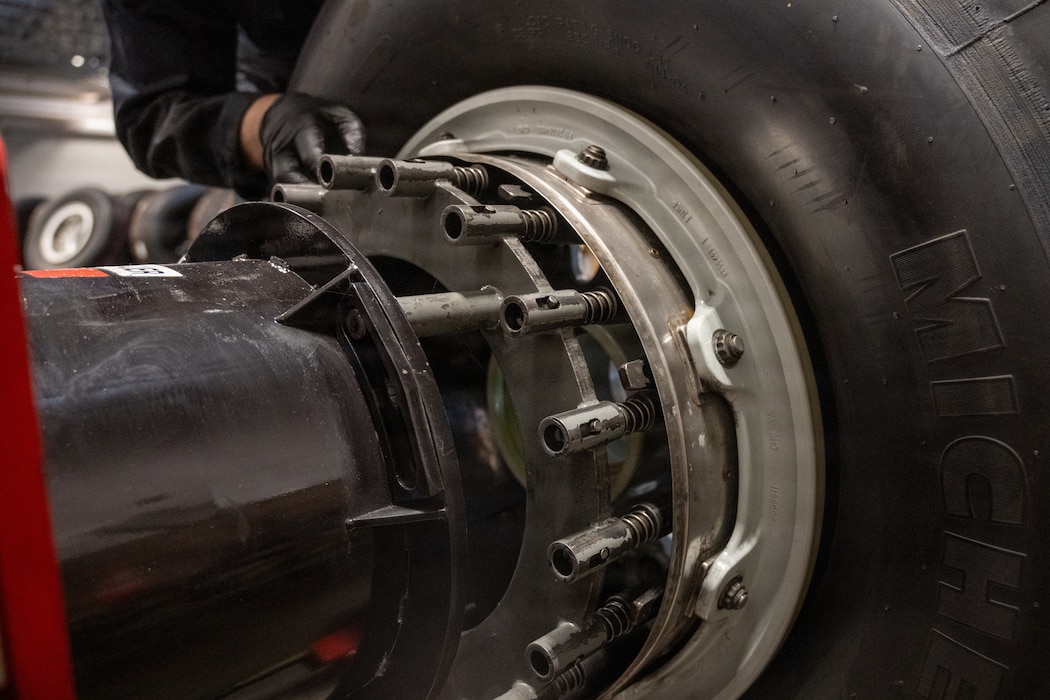 Tire being loaded onto machine