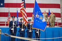 honor guard presents colors during change of command ceremony