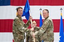 Colonel Glynn gives guidon to general epperson