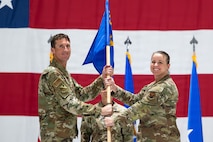 General Epperson gives guidon to Colonel Littlejohn