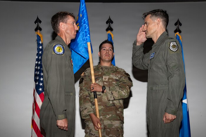 Col. Matthew Swanson  salutes Brig. Gen. David Epperson