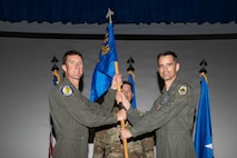 Col. Matthew Swanson passes the unit guidon to Brig. Gen. David Epperson