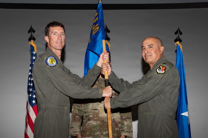 Brig. Gen. David Epperson passes the unit guidon to Col. Hector Ortega