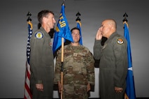 Col. Hector M. Ortega salutes Brig. Gen. David Epperson
