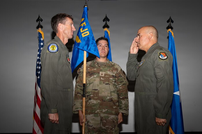 Col. Hector M. Ortega salutes Brig. Gen. David Epperson