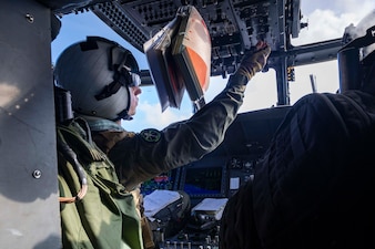 U.S. Navy Cmdr. Steve Vandal prepares an MH-60R Sea Hawk helicopter, attached to Helicopter Maritime Strike Squadron (HSM) 71, for take-off on the flight deck of Nimitz-class aircraft carrier USS Abraham Lincoln (CVN 72) a fueling-at-sea with Henry J. Kaiser-class fleet replenishment oiler USNS Henry J. Kaiser (T-AO 187) on Dec. 21, 2025. USS Abraham Lincoln (CVN 72), flagship of the Abraham Lincoln Carrier Strike Group, is underway conducting routine operations in the U.S. 7th Fleet area of operations, demonstrating the U.S. Navy’s long-term commitment to a free and open Indo-Pacific. (U.S. Navy photo by Mass Communication Specialist Seaman Zoe Simpson)
