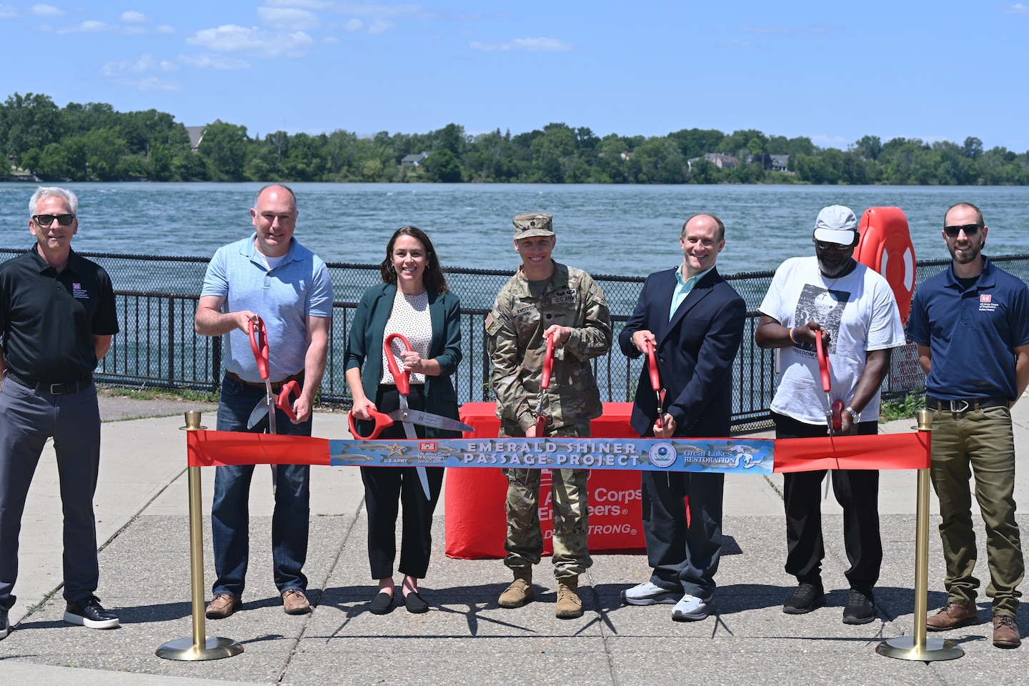 Members of the U.S. Army Corps of Engineers and project partners for the Emerald Shiner Fish Passage cut a ceremonial ribbon to mark completion of construction of the project in Buffalo, New York, July 23, 2026.