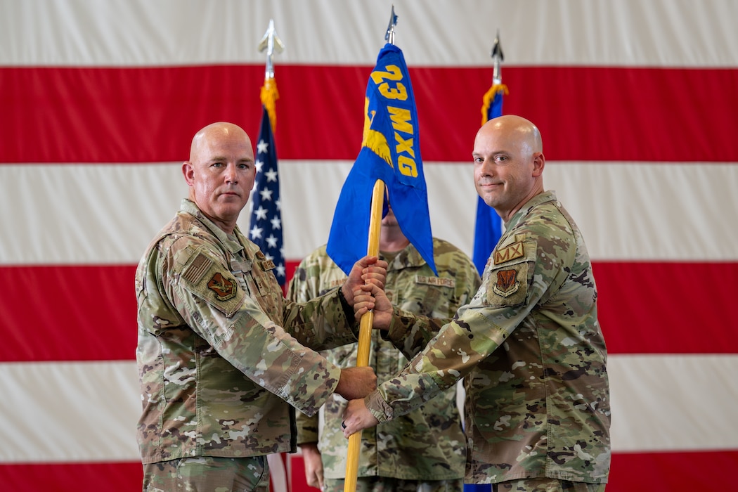 Guidon being passed to incoming commander