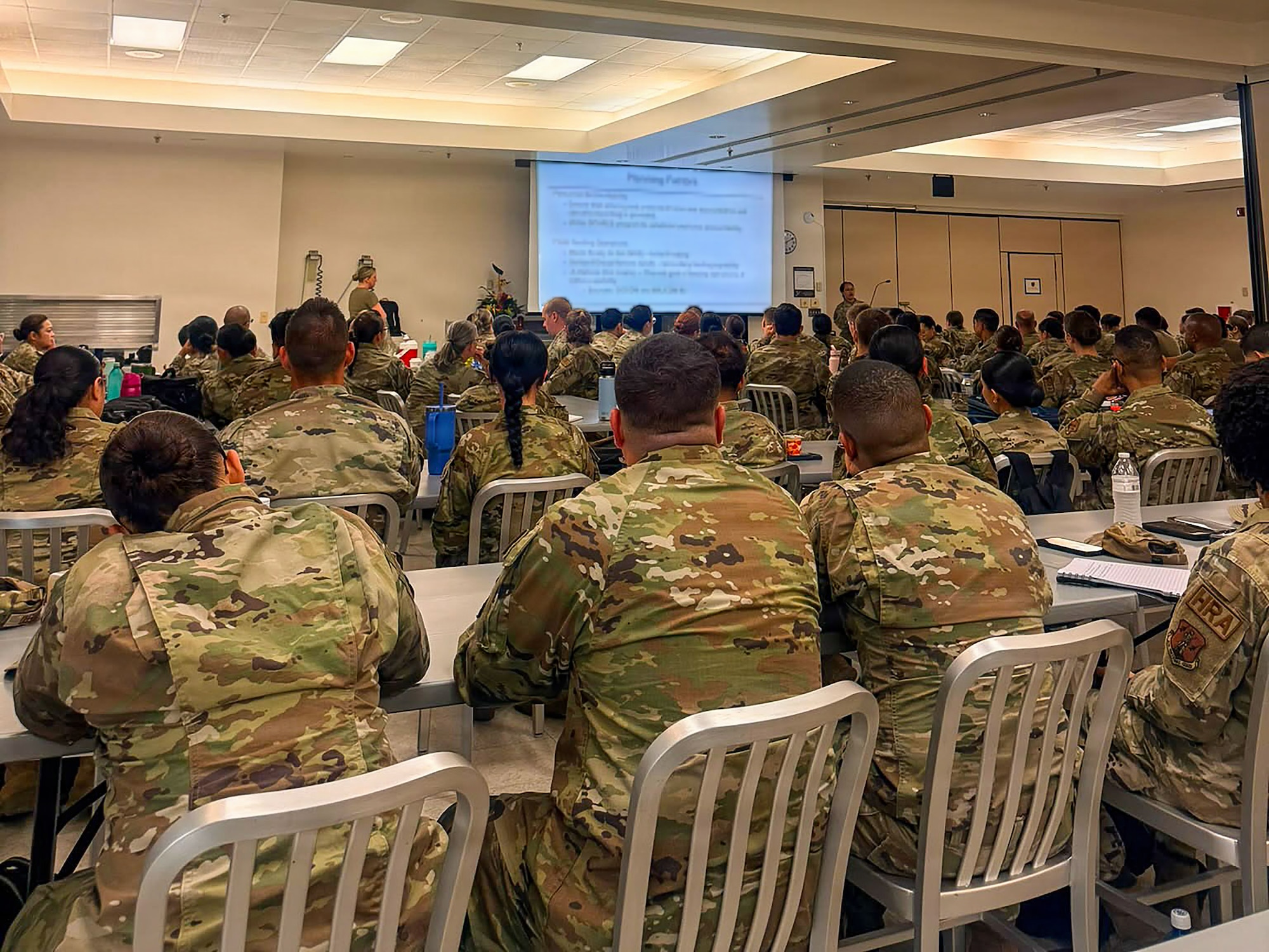 U.S. Airmen with the Air National Guard assigned to force support squadrons from Colorado, Nevada, Oregon, and Puerto Rico, attend a briefing during the fiscal year 2026 Home Station Readiness Training at Joint Base Pearl Harbor-Hickam, Hawaii, June 16, 2026. The FY26 HSRT is a Joint total force integration training involving the 140th FSS, 154th FSS, 142nd FSS, 936th FSS, and 156th FSS, designed to test participants expeditionary capabilities and ensure that force support personnel are prepared to perform their mission in a contested environment. (U.S. Air National Guard courtesy photo)