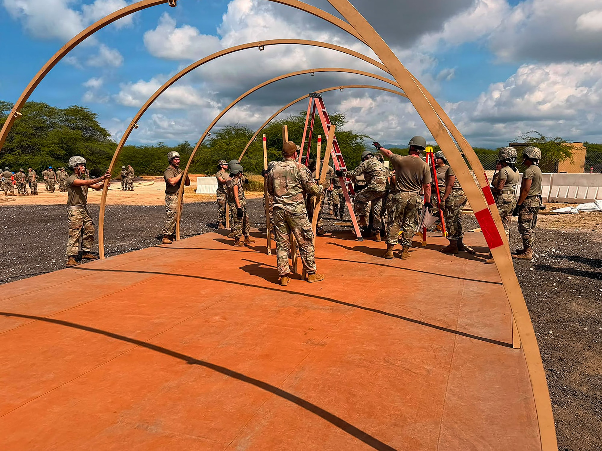 U.S. Airmen with the Air National Guard assigned to force support squadrons from Colorado, Nevada, Oregon, and Puerto Rico, assemble a tent during the fiscal year 2026 Home Station Readiness Training at Joint Base Pearl Harbor-Hickam, Hawaii, June 17, 2026. The FY26 HSRT is a Joint total force integration training involving the 140th FSS, 154th FSS, 142nd FSS, 936th FSS, and 156th FSS, designed to test participants expeditionary capabilities and ensure that force support personnel are prepared to perform their mission in a contested environment. (U.S. Air National Guard courtesy photo)