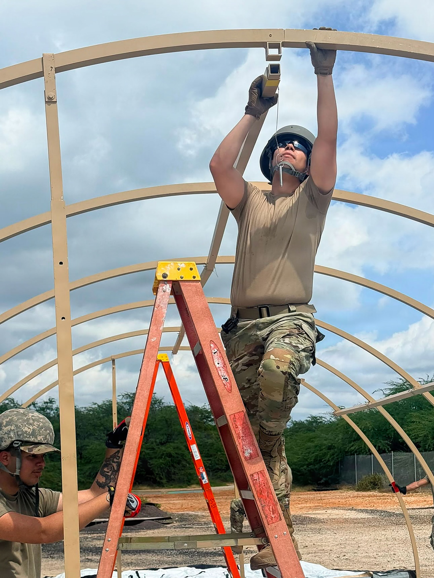 U.S. Airmen with the 156th Force Support Squadron, Puerto Rico Air National Guard, assemble a tent during the fiscal year 2026 Home Station Readiness Training at Joint Base Pearl Harbor-Hickam, Hawaii, June 17, 2026. The FY26 HSRT is a Joint total force integration training involving the 140th FSS, 154th FSS, 142nd FSS, 936th FSS, and 156th FSS, designed to test participants expeditionary capabilities and ensure that force support personnel are prepared to perform their mission in a contested environment. (U.S. Air National Guard courtesy photo)