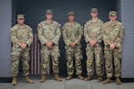(From the left) Sgt. Louis Ferdinando, 1st Lt. Jacob Wagner, Spc. Fredie Cerrano, Spc. Brayden Cundiff, and Spc. Ryan Austin, all with the Georgia Army National Guard, U.S. Army, assigned to Joint Task Force-District of Columbia (JTF-DC) in support of the D.C. Safe and Beautiful mission, pose for a photo in Arlington, V.A., July 21, 2026. Approximately 5,000 National Guard members are supporting the mission, providing critical assistance to the Metropolitan Police Department to help ensure the safety of residents, commuters, and visitors throughout the District. (U.S. Army National Guard photo by Spc. Makayla Panzer)