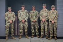 (From the left) Sgt. Louis Ferdinando, 1st Lt. Jacob Wagner, Spc. Fredie Cerrano, Spc. Brayden Cundiff, and Spc. Ryan Austin, all with the Georgia Army National Guard, U.S. Army, assigned to Joint Task Force-District of Columbia (JTF-DC) in support of the D.C. Safe and Beautiful mission, pose for a photo in Arlington, V.A., July 21, 2026. Approximately 5,000 National Guard members are supporting the mission, providing critical assistance to the Metropolitan Police Department to help ensure the safety of residents, commuters, and visitors throughout the District.