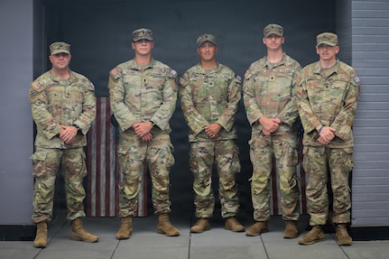 (From the left) Sgt. Louis Ferdinando, 1st Lt. Jacob Wagner, Spc. Fredie Cerrano, Spc. Brayden Cundiff, and Spc. Ryan Austin, all with the Georgia Army National Guard, U.S. Army, assigned to Joint Task Force-District of Columbia (JTF-DC) in support of the D.C. Safe and Beautiful mission, pose for a photo in Arlington, V.A., July 21, 2026. Approximately 5,000 National Guard members are supporting the mission, providing critical assistance to the Metropolitan Police Department to help ensure the safety of residents, commuters, and visitors throughout the District.