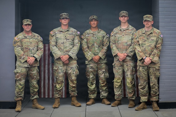 (From the left) Sgt. Louis Ferdinando, 1st Lt. Jacob Wagner, Spc. Fredie Cerrano, Spc. Brayden Cundiff, and Spc. Ryan Austin, all with the Georgia Army National Guard, U.S. Army, assigned to Joint Task Force-District of Columbia (JTF-DC) in support of the D.C. Safe and Beautiful mission, pose for a photo in Arlington, V.A., July 21, 2026. Approximately 5,000 National Guard members are supporting the mission, providing critical assistance to the Metropolitan Police Department to help ensure the safety of residents, commuters, and visitors throughout the District.