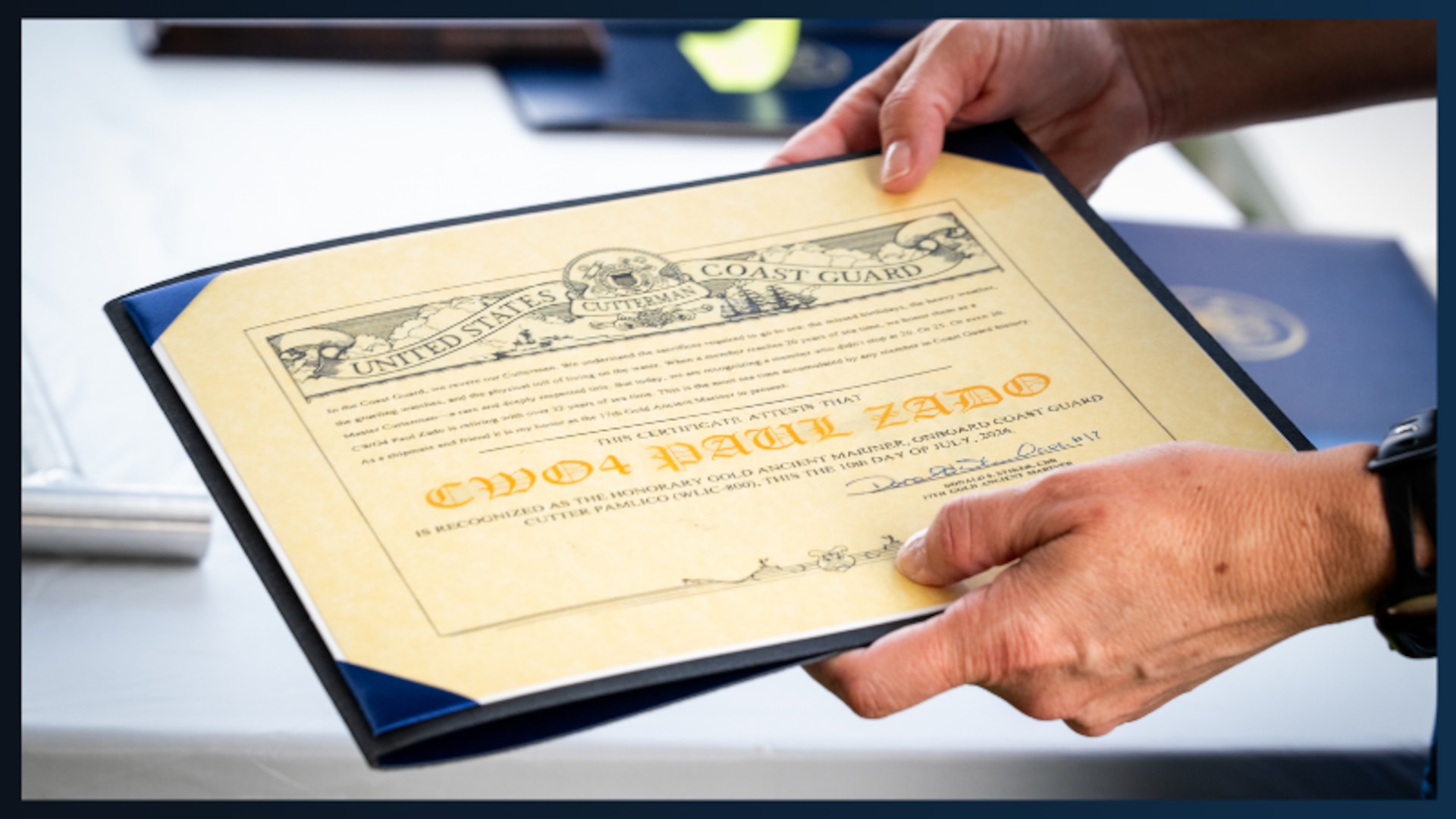 U.S. Coast Guard Chief Warrant Officer Paul Zado's retirement paperwork is shown here during his retirement ceremony in New Orleans, Louisiana, July 10, 2026. Zado and the crew of the USCGC Pamlico were responsible for developing an alternate waterway following hurricane Ida's devastation of the lower Mississippi River. (U.S. Coast Guard photo by Petty Officer 3rd Class Cheyenne Basurto)