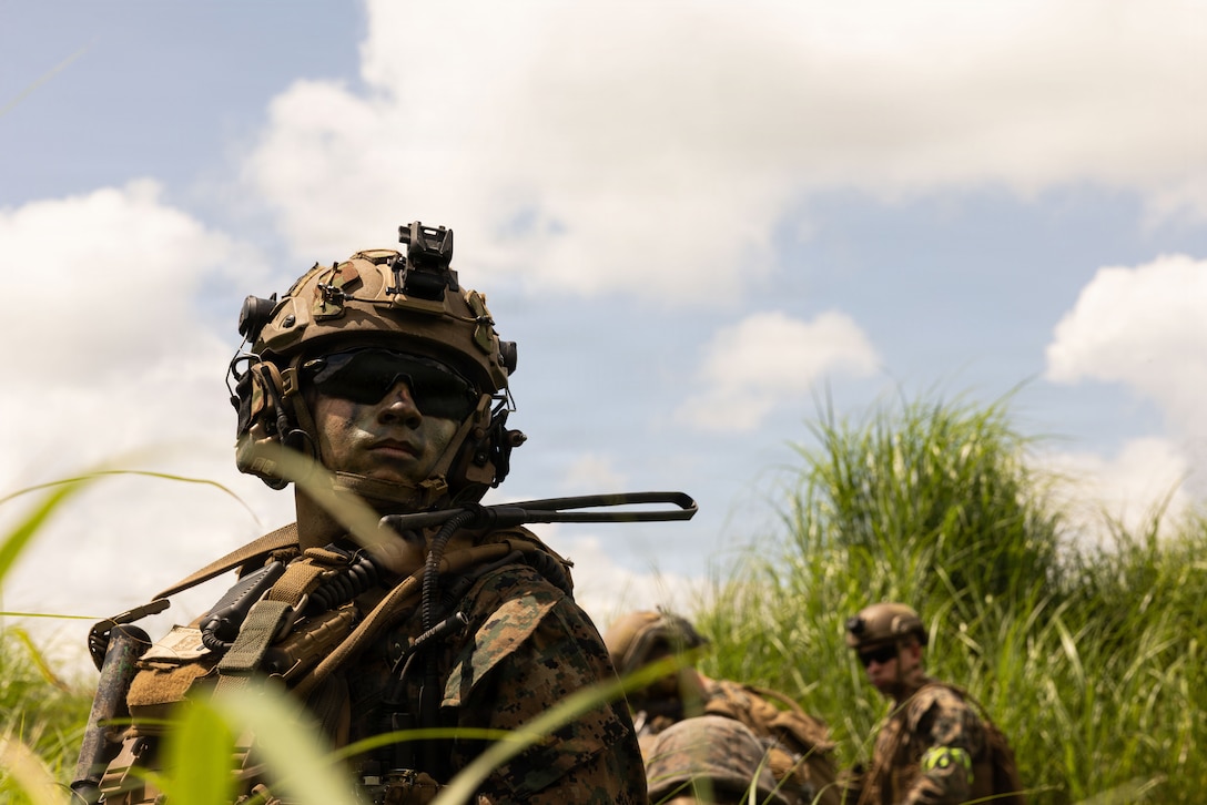 U.S. Marine Corps 1st Lt. Aiden Nelson, an infantry officer with 12th Littoral Combat Team, 12th Marine Littoral Regiment, 3rd Marine Division, observes the area during a bilateral range during Resolute Dragon 26 at Japan Self-Defense Force Hijudai Maneuver Area, Oita Prefecture, Japan, June 28, 2026. Resolute Dragon 26 is an annual bilateral exercise in Japan that strengthens the command, control, and multi-domain maneuver capabilities of U.S. Marines in III Marine Expeditionary Forces and Japan Self-Defense Forces personnel, with a focus on controlling and defending key maritime terrain. Nelson is a native of Florida. (U.S. Marine Corps photo by Lance Cpl. Camila Garibay)