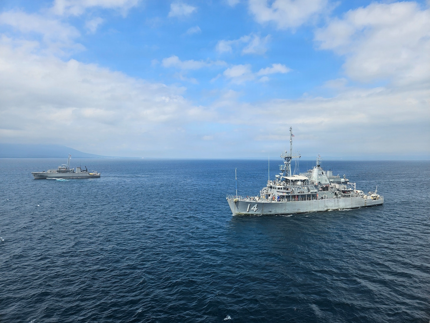 U.S. Navy Avenger-class mine countermeasures ship USS Chief (MCM 14) and Japan Maritime Self-Defense Force coastal mine sweepers JS Kuroshima (MSC-692), left, and JS Miyajima (MSC-690), back right, conduct a group sail during Mine Warfare Exercise 2JA, July 20, 2026. 2JA is part of a year-long series of bilateral exercises between the U.S. Navy and JMSDF to strengthen interoperability and increase proficiency in mine countermeasure operations. (U.S. Navy photo by Lt. Jacob Kinnear)