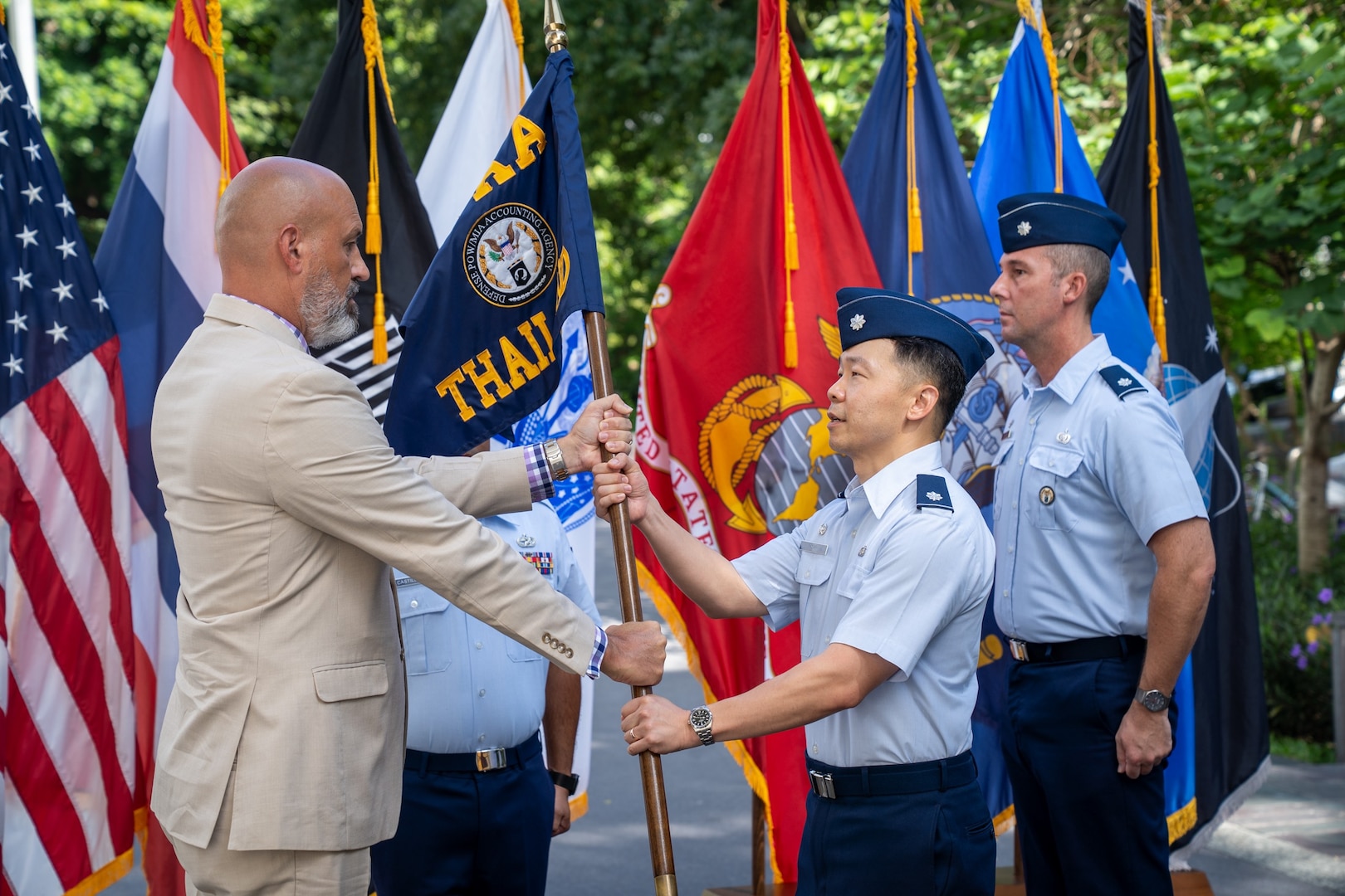 U.S. Air Force Lt. Col. Jee Chung, incoming Defense POW/MIA Accounting Agency Detachment 1 leader, assumes authority from Christopher Phelps, DPAA Indo-Pacific director, during a Detachment 1 change of leadership ceremony at the U.S. Embassy in Bangkok, July 15, 2026.