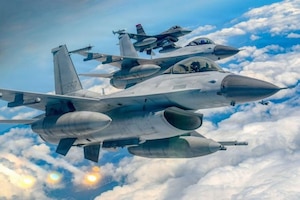 A South Korean Air Force KF-16 fighter jet fires flares during formation flight with a U.S. Air Force F-16 fighter jet during the 26th-2nd Twin Eagle Exercise. (Courtesy Photo)