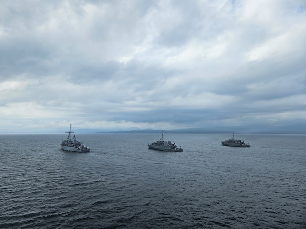 From left, U.S. Navy Avenger-class mine countermeasures ship USS Chief (MCM 14), and Japan Maritime Self-Defense Force coastal mine sweepers JS Miyajima (MSC-690) and JS Kuroshima (MSC-692) conduct a group sail during Mine Warfare Exercise 2JA, July 20, 2026. 2JA is part of a year-long series of bilateral exercises between the U.S. Navy and JMSDF to strengthen interoperability and increase proficiency in mine countermeasure operations. (U.S. Navy photo by Lt. Jacob Kinnear)