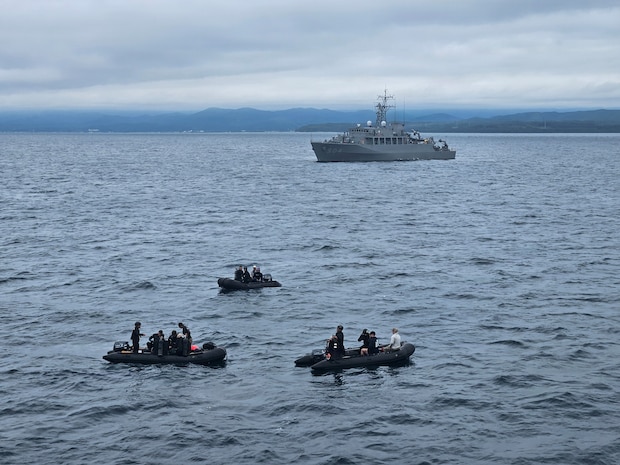 Explosive Ordnance Disposal Mobile Unit 5 and Japan Maritime Self-Defense Force explosive ordnance disposal sailors conduct mine countermeasure diving operations near JMSDF ocean mine sweeper JS Awaji (MSO-304) during Mine Warfare Exercise (MINEX) 2JA, July 14, 2026. 2JA is part of a year-long series of bilateral exercises between the U.S. Navy and Japan Maritime Self-Defense Force MSDF to strengthen interoperability and increase proficiency in mine countermeasure operations. (U.S. Navy photo by Lt. Jacob Kinnear)