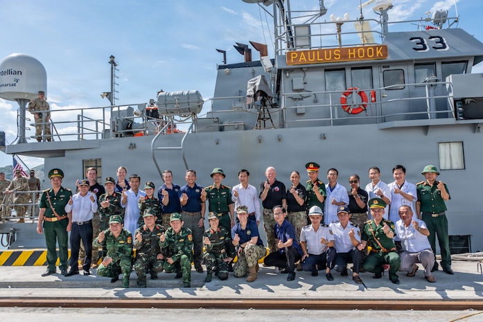 Pacific Friendship 2026 (PF26) and Pacific Partnership 2026 (PP26) leadership and medical personnel, members of the Vietnam People’s Armed Forces, Vietnamese civilian medical professionals, and representatives from the Canadian Armed Forces and German Armed Forces pose for a group photo following a PF26-led mass casualty (MASCAL) drill aboard U.S. Army Runnymede-class landing craft utility ship USAV Paulus Hook (LCU 2033) at Hon La Port in Quang Tri, Vietnam, July 2, 2026.