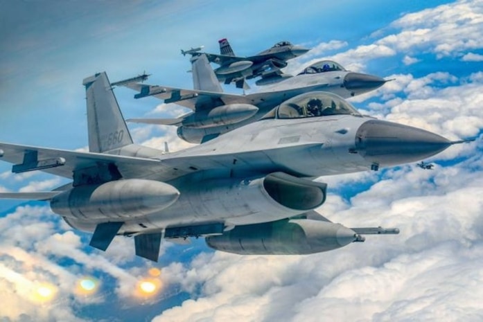 A South Korean Air Force KF-16 fighter jet fires flares during formation flight with a U.S. Air Force F-16 fighter jet during the 26th-2nd Twin Eagle Exercise. (Courtesy Photo)