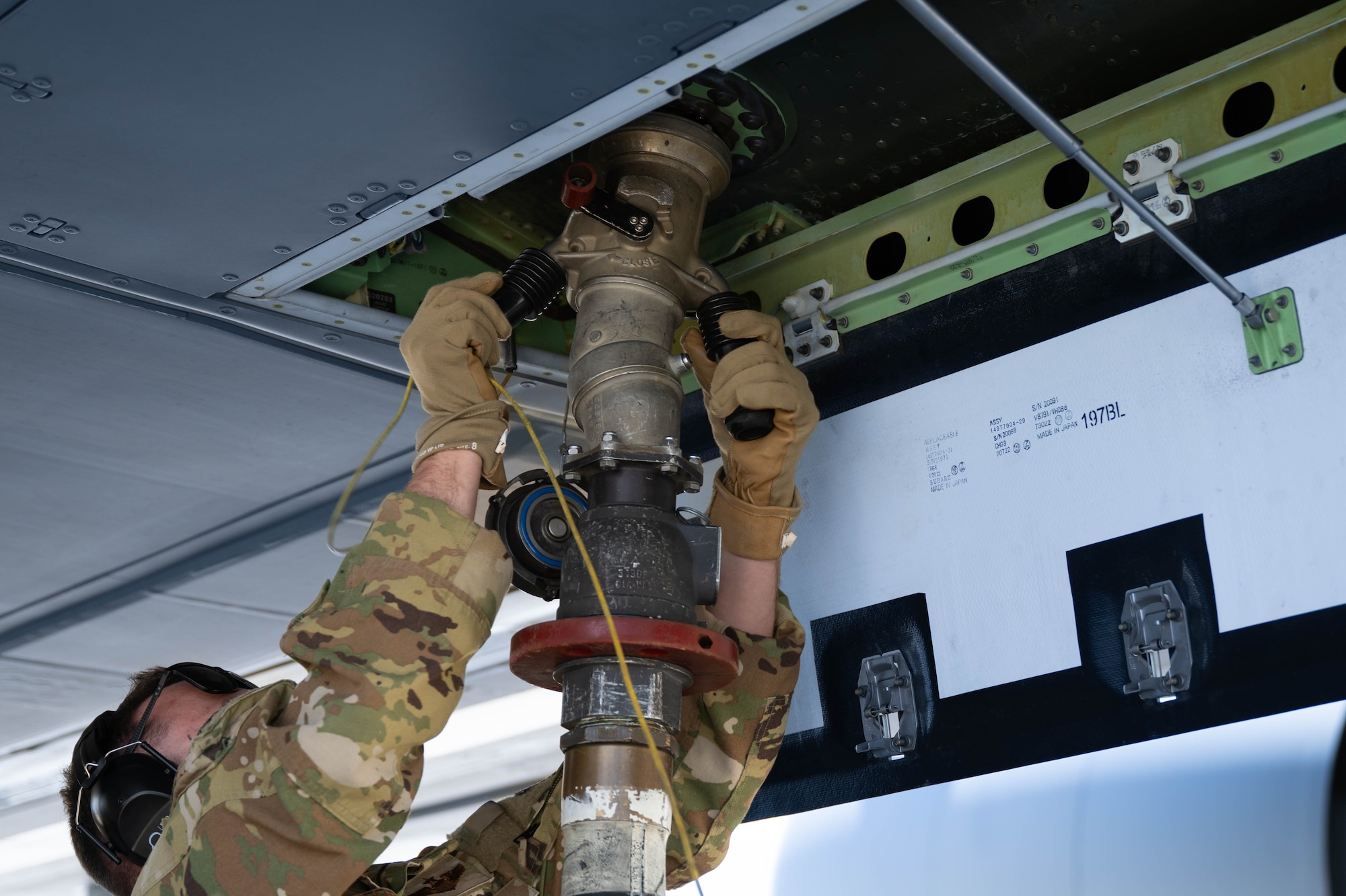 U.S. Air Force Maj. Michael Renna, 32nd Air Refueling Squadron pilot, places a fuel line on a KC-46A Pegasus, Aircraft during specialized fueling operations at Joint Base McGuire-Dix-Lakehurst, N.J., June 29, 2026.