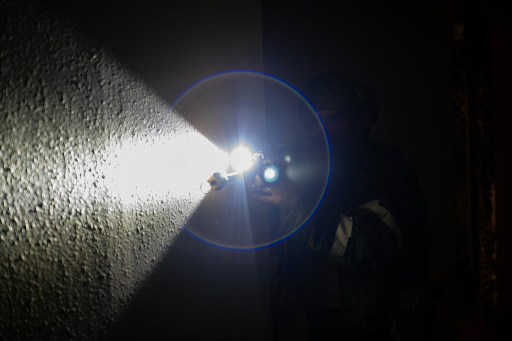 U.S. Air Force Tech. Sgt. Kelsey Corey, 8th Security Forces Squadron Echo Flight chief ​￼​team lead, performs a security sweep of a hallway during exercise Beverly Sentinel 26-4, at Kunsan Air Base, Republic of Korea, July 23, 2026. By testing emergency response and mission generation capabilities, the exercise was designed to prepare personnel to execute duties under contested operational conditions. (U.S. Air Force photo by Staff Sgt. Cedrique Oldaker)