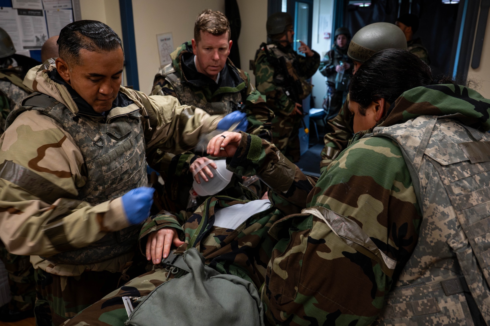 U.S. Air Force Airmen assigned to the 8th Medical Group perform clinical triage on a simulated casualty during exercise Beverly Sentinel 26-4, at Kunsan Air Base, Republic of Korea, July 23, 2026. By testing emergency response and mission generation capabilities, the exercise was designed to prepare personnel to execute duties under contested conditions. (U.S. Air Force photo by Staff Sgt. Cedrique Oldaker)