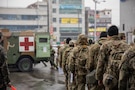 A Republic of Korea Army nursing officer from Daejeon Armed Forces Hospital directs U.S. Army soldiers acting as simulated casualties as they board a ROK Army ambulance at Daejeon Station, South Korea, on March 18, 2026. Dragon Lift, an intra-theater evacuation exercise during Freedom Shield 26, simulates mass-casualty movement from initial care to definitive treatment, validating multinational interoperability for rapid casualty transport and care in support of the combined defense of the peninsula. (U.S. Army photo by Cpl. Eun Jun Choi.)