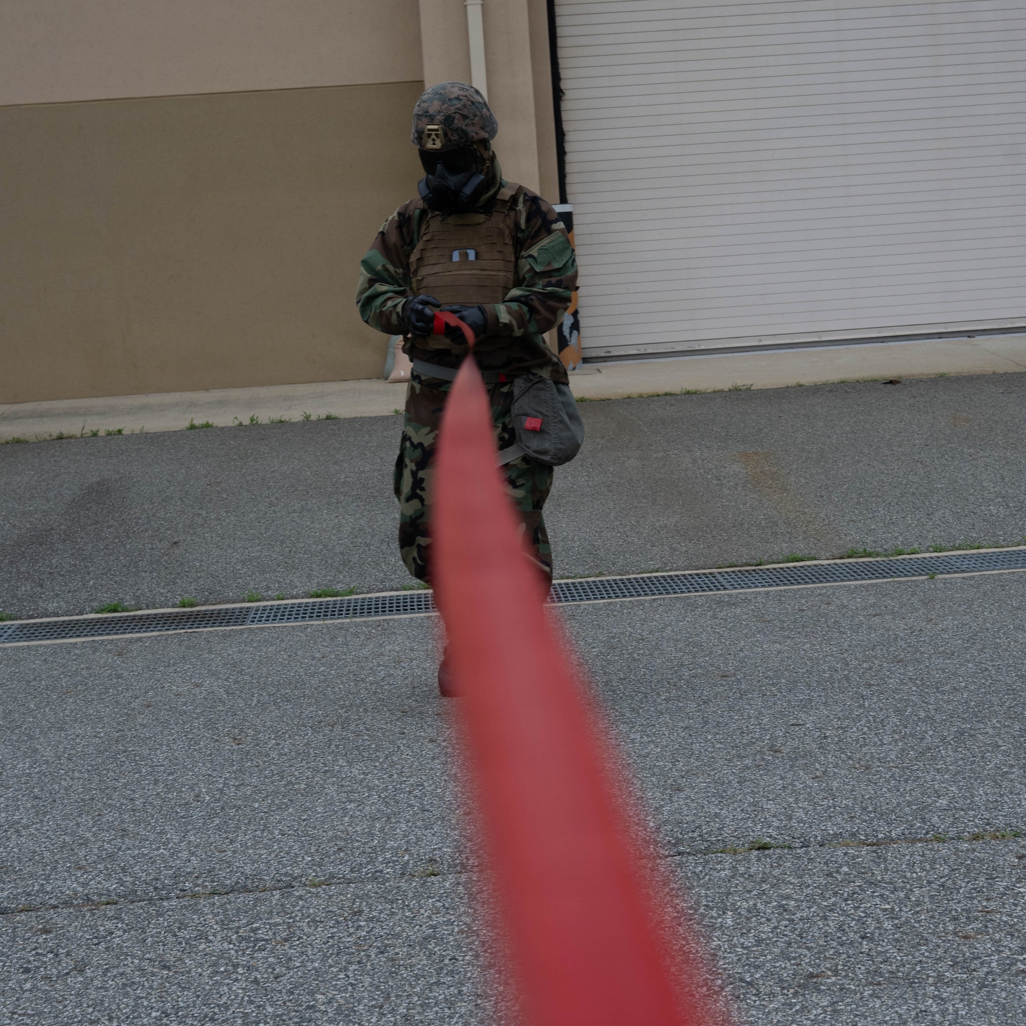 A Marine cordons an area.