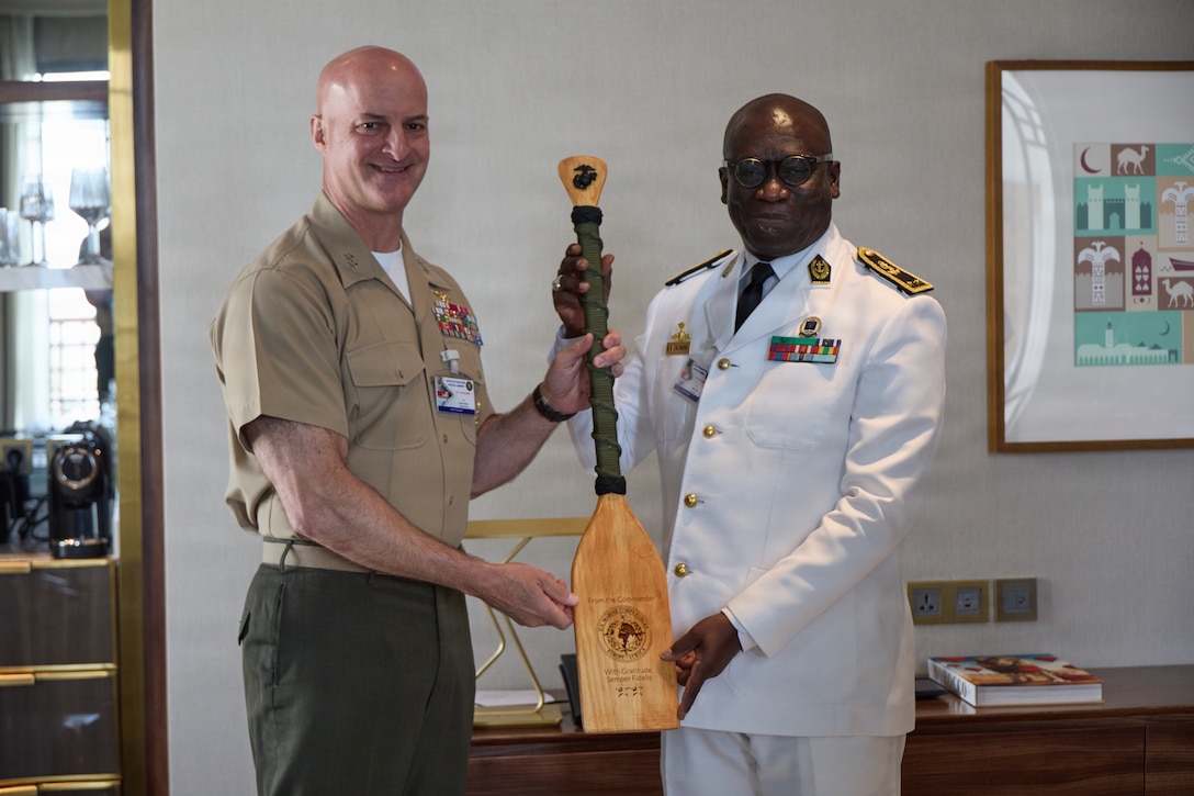 U.S. Marine Corps Maj. Gen. Daniel Shipley, commander of U.S. Marine Corps Forces, Europe and Africa, left, gives a gift to Senegal Navy Adm. Abdou Sene, right, in Rabat, Morocco, July 21, 2026. Shipley and Sene met during African Maritime Forces Summit 2026 to build their relationship and discuss the complexities of maritime security. Co-hosted by the Royal Moroccan Armed Forces, U.S. Naval Forces Africa, and U.S. Marine Corps Forces, Europe and Africa, AMFS 2026 brings together international partners to address shared security challenges under the theme "Innovation and Partnership to Strengthen Maritime Security." (U.S. Marine Corps photo by Cpl. Garrett Gillespie)