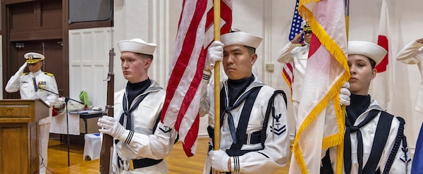 YOKOSUKA, Japan (July 23, 2026) — U.S. Navy Medicine Readiness and Training Command (USNMRTC) Yokosuka color guard present colors during the USNMRTC Yokosuka change of command ceremony at Commander, Fleet Activities Yokosuka's C2 Auditorium. The ceremony formally transferred command from Capt. Torrin W. Velazquez to Capt. Joshua A. Miller. USNMRTC Yokosuka delivers patient- and family-centered healthcare while developing and delivering trained, ready medical forces in support of U.S. Indo-Pacific Command. (U.S. Navy photo by Daniel Taylor/USNH Yokosuka Public Affairs)
