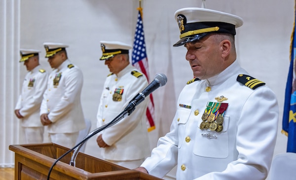 YOKOSUKA, Japan (July 23, 2026) — Lt. Cmdr. Daniel Robinson, command chaplain for U.S. Navy Medicine Readiness and Training Command (USNMRTC) Yokosuka delivers the invocation during the USNMRTC Yokosuka change of command ceremony at Commander, Fleet Activities Yokosuka's C2 Auditorium. The ceremony marked the transfer of command from Capt. Torrin W. Velazquez to Capt. Joshua A. Miller. USNMRTC Yokosuka delivers patient- and family-centered healthcare while developing and delivering trained, ready medical forces in support of U.S. Indo-Pacific Command. (U.S. Navy photo by Daniel Taylor/USNH Yokosuka Public Affairs)