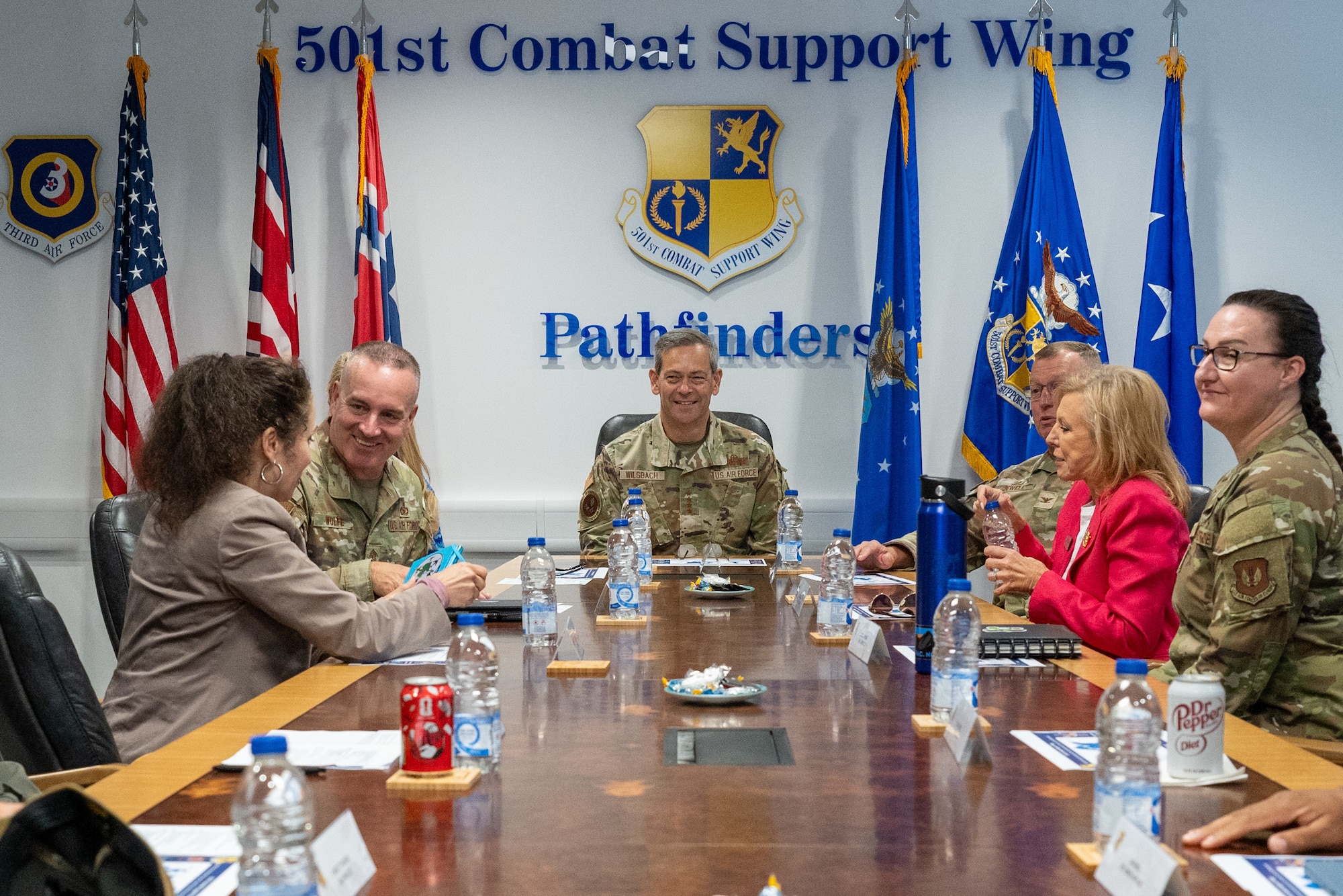 Chief of Staff of the Air Force Gen. Ken Wilsbach and Chief Master Sergeant of the Air Force David R. Wolfe and their spouses participate in a mission brief